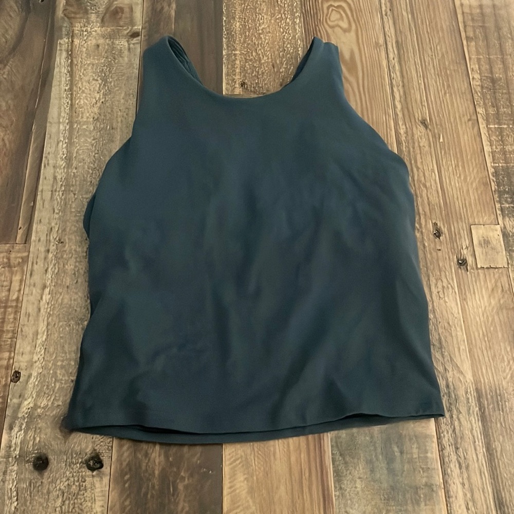 This is a gray tank top from Athleta Girl. It’s a size L/12.